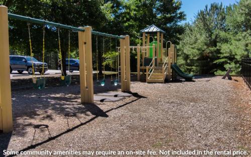 a playground with a slide in a park at Wanderers Den - Peaceful mountain views Wifi and homey comforts in Jasper