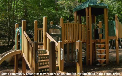 a bunch of wooden playground equipment in a park at Wanderers Den - Peaceful mountain views Wifi and homey comforts in Jasper