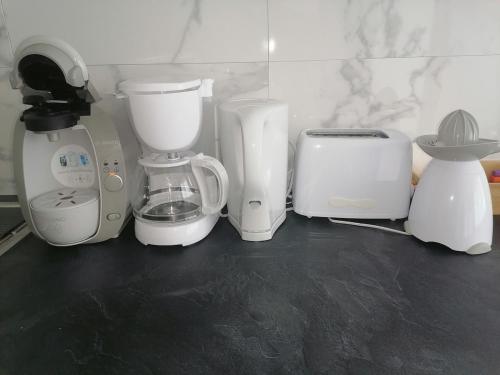 a group of appliances sitting on top of a counter at Le Tiot Saint Martin in Auxi-le-Château