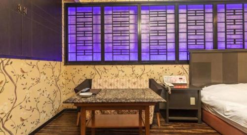 Tabist Hotel Please Kobeにあるベッド