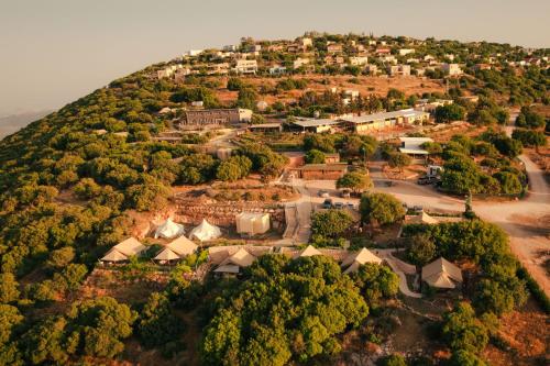 an aerial view of a village on a hill at Rom Farm by Glow - חוות רום in Kammon