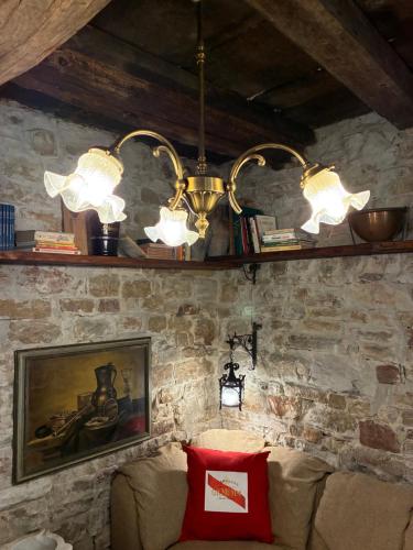 a living room with two lights and a couch at Agriturismo Le Pozze in Dicomano