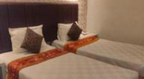 Postel nebo postele na pokoji v ubytování Jelita Tanjung Hotel
