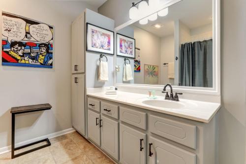 a bathroom with a sink and a mirror at The Grateful Den - Cozy retreat in Big Canoe in Jasper