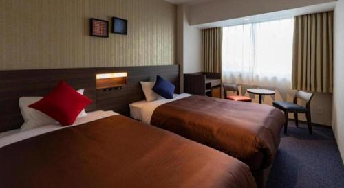 Кровать или кровати в номере HOTEL BAYGULLS