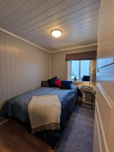 a bedroom with a bed in a small room at Apartment in Voss - Tråstølen in Skulestadmo