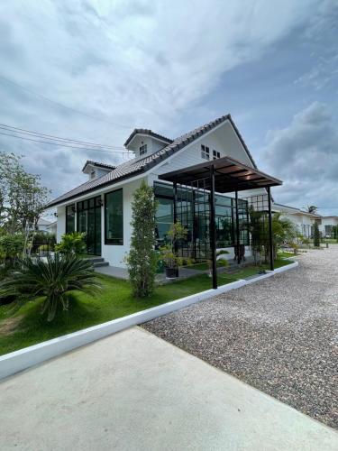 a house with a lot of windows at HomeGate Resort in Prachuap Khiri Khan