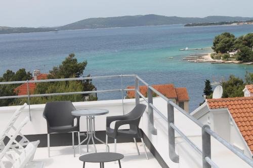 a balcony with a view of the water at Bila Vila Apartments in Zaboric