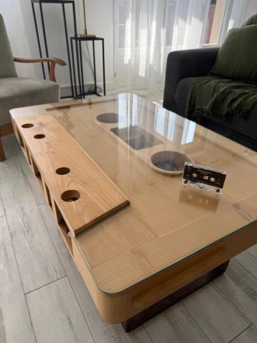 a wooden coffee table in a living room at LA PROVENCE fantastic apartment 75m2 Big pool private parking top location in Le Pontet