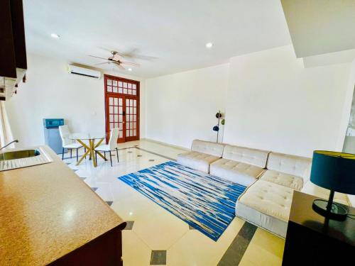 a living room with a couch and a table at 20, Suite for 4 People in Torreón
