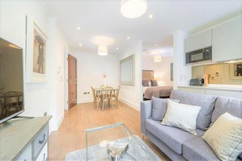a living room with a couch and a table at Luxury flat in Covent Garden in London