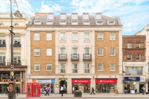 a building on a street with people walking in front of it at Luxury flat in Covent Garden in London