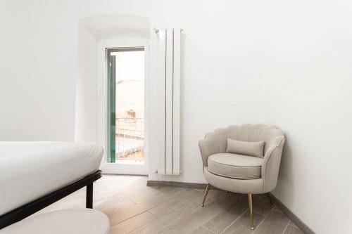 Ένα ή περισσότερα κρεβάτια σε δωμάτιο στο Apartment facing the sea and Navebus Porto Antico