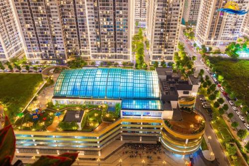a large building in a city with tall buildings at Nice&New Attic 1BR Apartment,closely to Parking ares, Seasalt Ocean, Freshwater Ocean of Hanoi city in Vinhomes Ocean Park in Hanoi