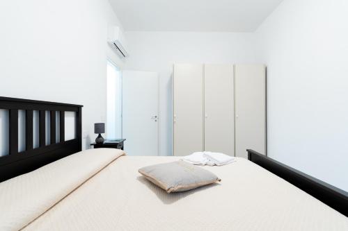 Ένα ή περισσότερα κρεβάτια σε δωμάτιο στο Casa a Giulianova a due passi dal mare