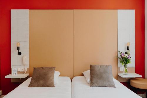 Postel nebo postele na pokoji v ubytování L'Hôtel Bristol