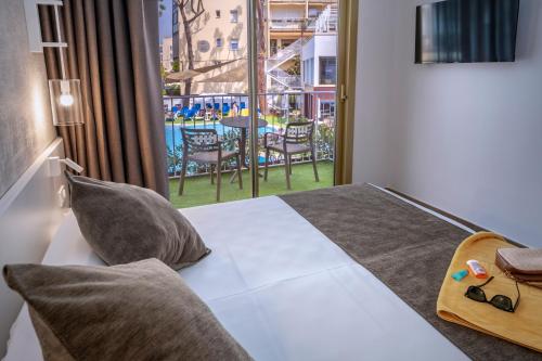 Postel nebo postele na pokoji v ubytování GHT Costa Brava & Spa