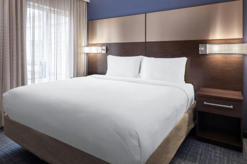 a large white bed in a hotel room at Residence Inn by Marriott Ann Arbor Downtown in Ann Arbor