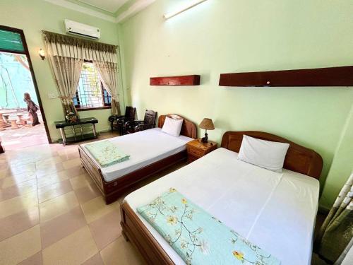 Ένα ή περισσότερα κρεβάτια σε δωμάτιο στο OYO 1297 Hotel Hung Lam