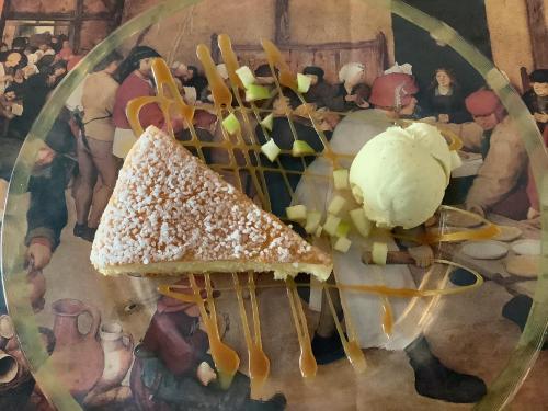a plate of food with a piece of bread and ice cream at Auberge de Marville in Marville