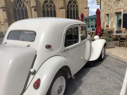 a white car parked in front of a building at Auberge de Marville in Marville