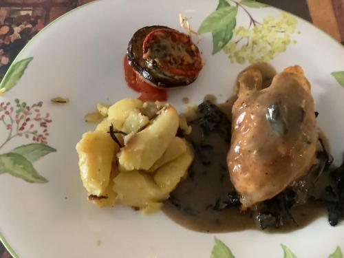 a plate of food with meat and potatoes on it at Auberge de Marville in Marville