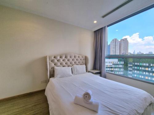 Postel nebo postele na pokoji v ubytování 123 Apartment - RiverGate Residence