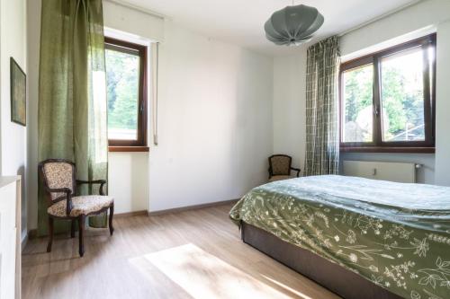 Postel nebo postele na pokoji v ubytování appartamento centralissimo vista terme