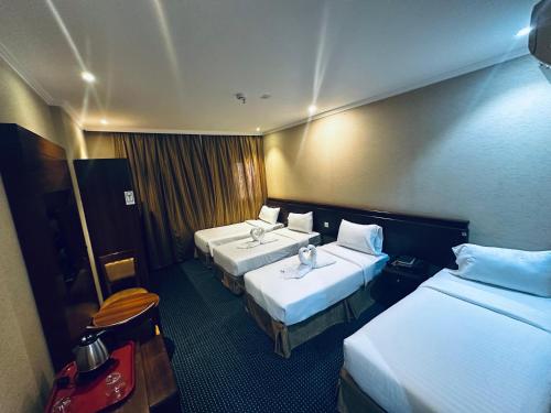 Diouf Al-Mquam Al-Masy Hotel Free shuttle service to the Haramにあるベッド