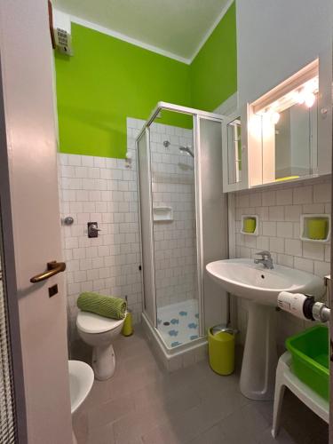 a bathroom with a shower and a toilet and a sink at RESIDENZA VALLE VIGEZZO in Santa Maria Maggiore