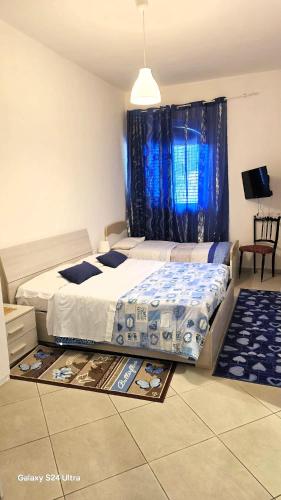 Postel nebo postele na pokoji v ubytování Casa Eraldo