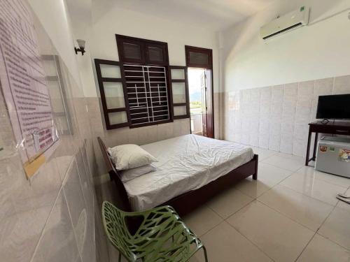 Postel nebo postele na pokoji v ubytování POP 1296 Phú Lộc Xuân Hotel Danang