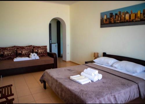 Postel nebo postele na pokoji v ubytování Hotel Olimp