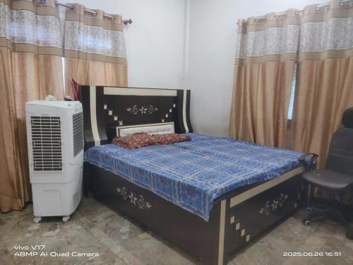 Postel nebo postele na pokoji v ubytování Vaidhya Bhavan Homestay
