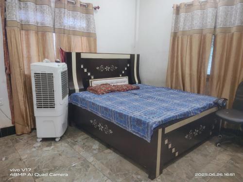 Postel nebo postele na pokoji v ubytování Vaidhya Bhavan Homestay