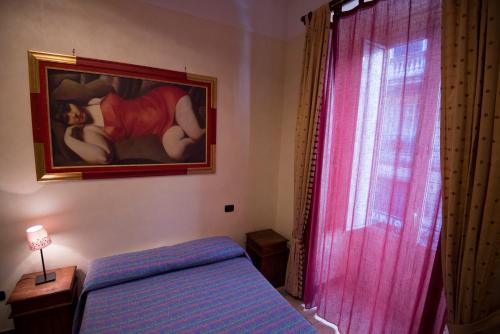 Katil atau katil-katil dalam bilik di Schilizzi Hotel