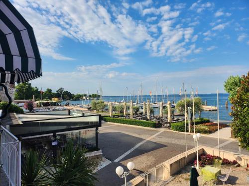 a view of a marina with boats in the water at Hotel Alla Riviera in Bardolino