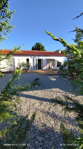 a house with a gravel driveway in front of it at Casa Nova in Njivice