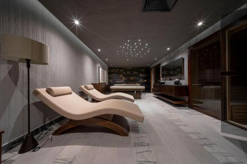 a living room with two chairs and a table at Casa Fontana in Alacati
