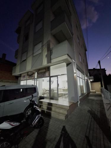 a motorcycle parked in front of a building at Apartments Josif in Gevgelija