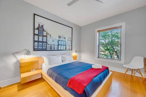 a bedroom with a large bed and a window at Steps to the Lakefront! This Uptown Beauty is Everything You Need for a Perfect Chicago Getaway condo in Chicago