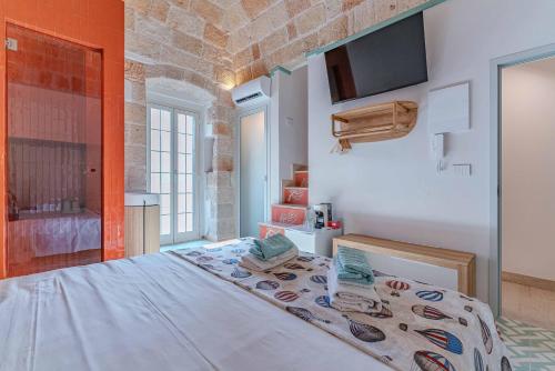 a bedroom with a large bed in a room at AMar in Polignano a Mare