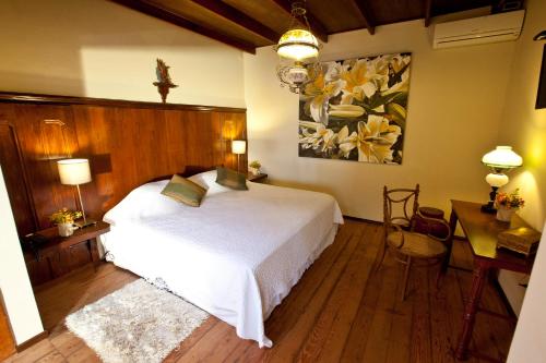 Un ou plusieurs lits dans un hébergement de l'établissement Hotel & Hacienda El Carmelo