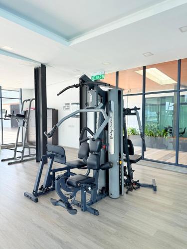 a gym with cardio equipment in a building at Kuching Vivacity Jazz Suite 4 YM Homestay 3 bedroom 2 bathroom in Kuching