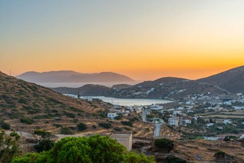 a view of the town of positano at sunset at Country House Apartments in Ios Chora