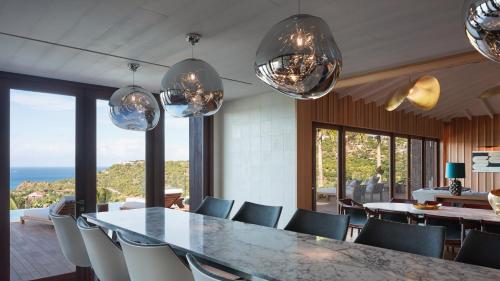 a dining room with a table and chairs at Exclusive Villa in a Privileged Place in Gustavia