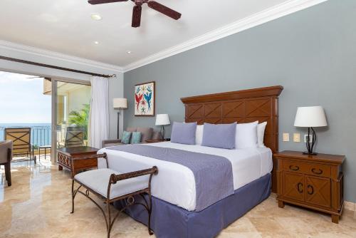 a bedroom with a large bed and a balcony at Beachside Escape at Riviera Nayarit w Pool in Nuevo Vallarta
