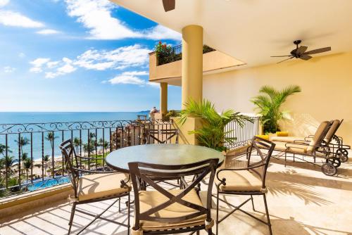 a balcony with a table and chairs and the ocean at Beachside Escape at Riviera Nayarit w Pool in Nuevo Vallarta