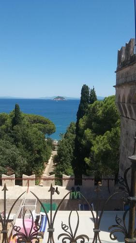 a view of the ocean from a building at Castello Bellariva with Swimming Pool and Tennis Court in Cavo