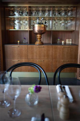 a table with wine glasses and a trophy in a room at Radisson Blu Hotel Uppsala in Uppsala